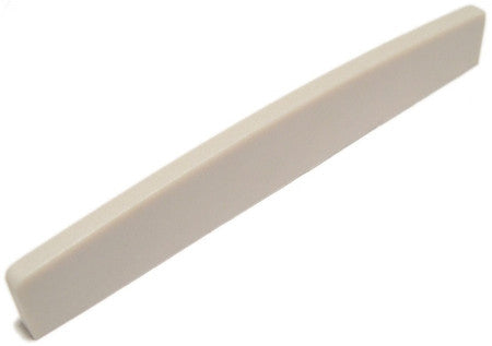 Off-white rectangular plastic saddle piece for guitar or similar instrument.