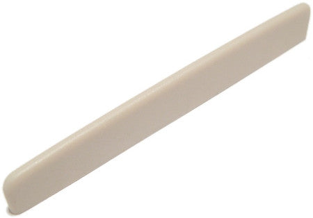 Off-white guitar saddle with a smooth, curved top edge shown on a white background.
