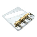 Close-up of a metal guitar bridge with brass saddles and adjustment springs on a silver base plate.