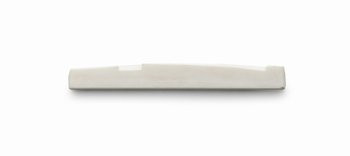 A single off-white bone guitar saddle piece with a slight curve and compensated notches.