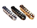 Three metal guitar tune-o-matic style bridges with arched plates in silver, black, and gold finishes.