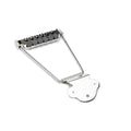 Nickel-colored trapeze tailpiece with fine tuners for guitar strings labeled BADASS FTT