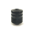 Black cylindrical metal barrel button with textured grip and a hex screw recess on top.