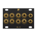 Black panel with ten gold jack sockets arranged in two rows and labeled DC-S