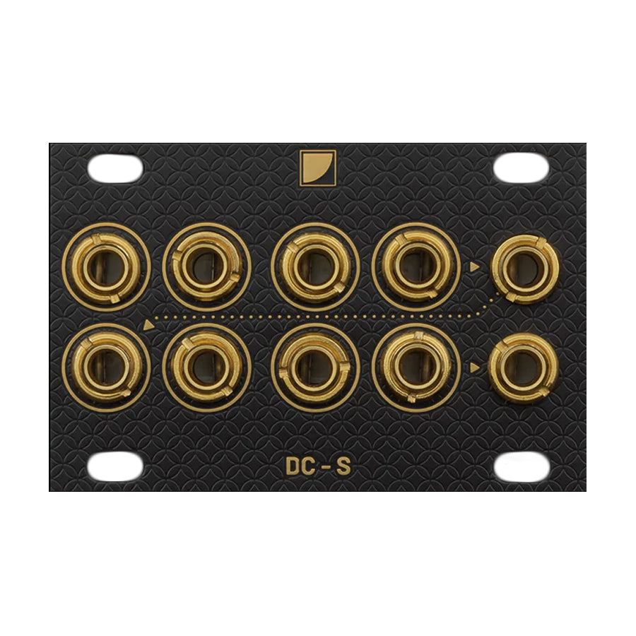 Black panel with ten gold jack sockets arranged in two rows and labeled DC-S