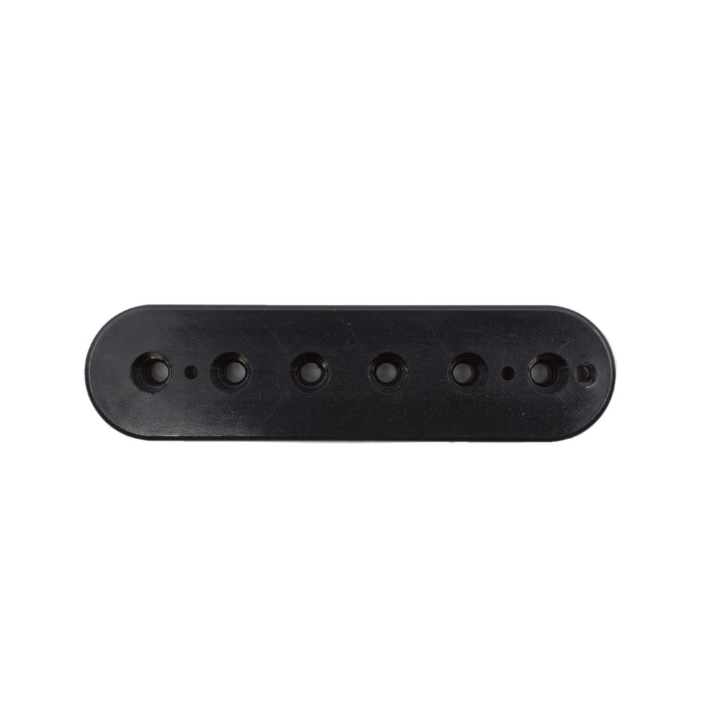 Black elongated plastic component with six circular holes and two small dots, front view on white background.