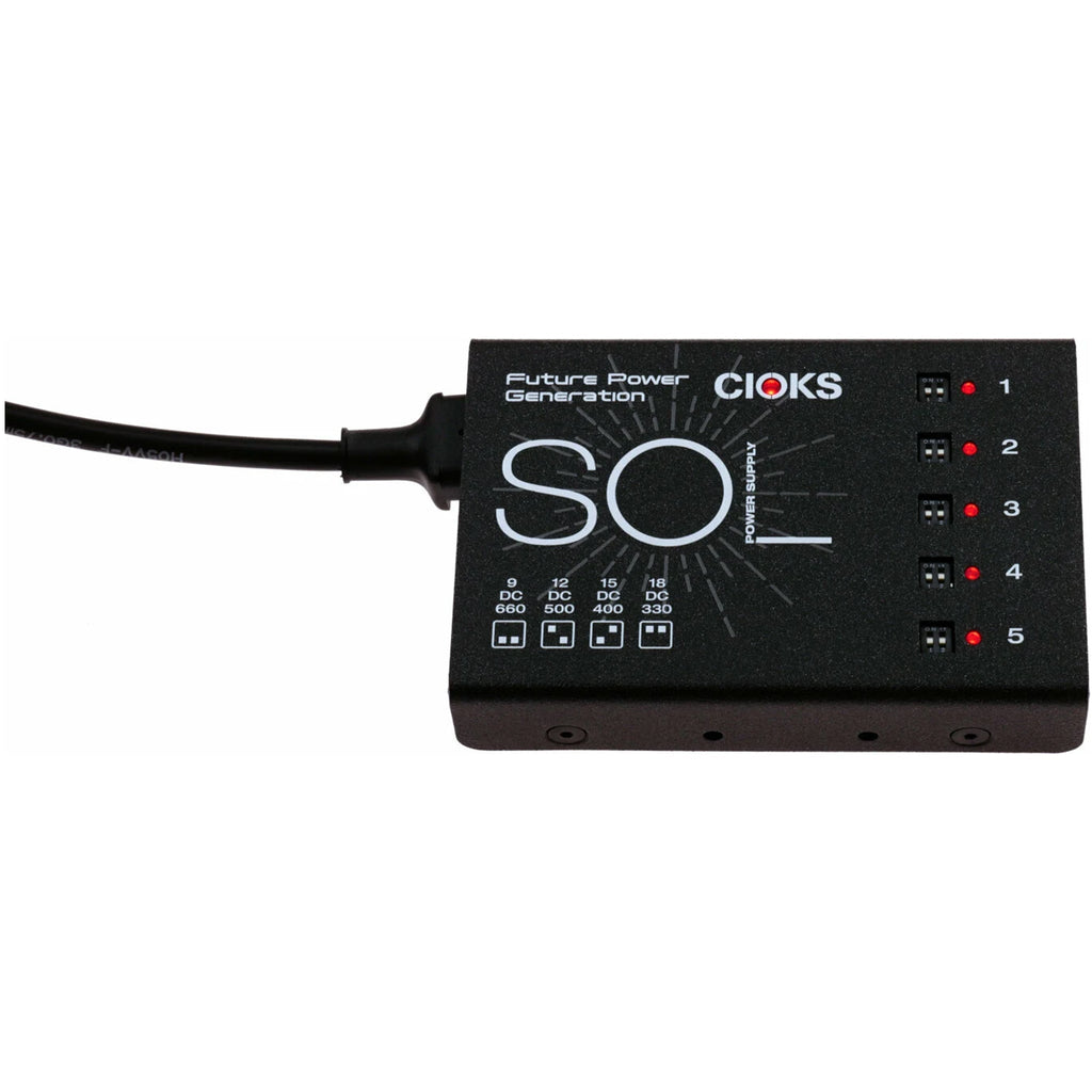 Black Cioks SOL power supply unit with 5 toggle switches and red LEDs, showing voltage ratings on top.