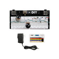 Electronic breadboard kit with components, power adapter, and resistor color code guide card.