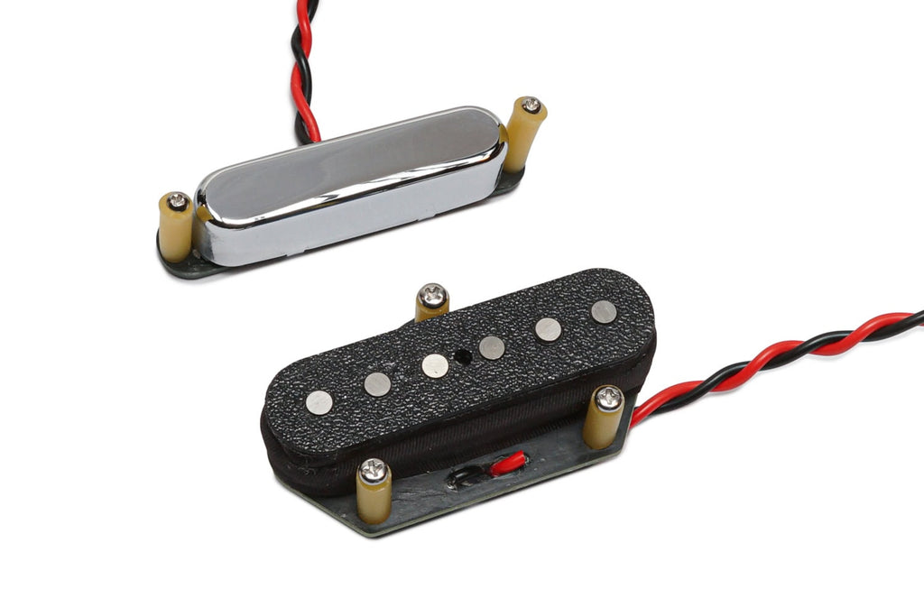 Two electric guitar pickups with black and silver covers and attached red and black wires on a white background.