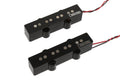 Two black rectangular electric bass guitar pickups with metal pole pieces and attached red and black wires.