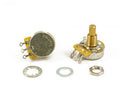 Two metal rotary potentiometers with solder lugs and mounting hardware laid out on white background.