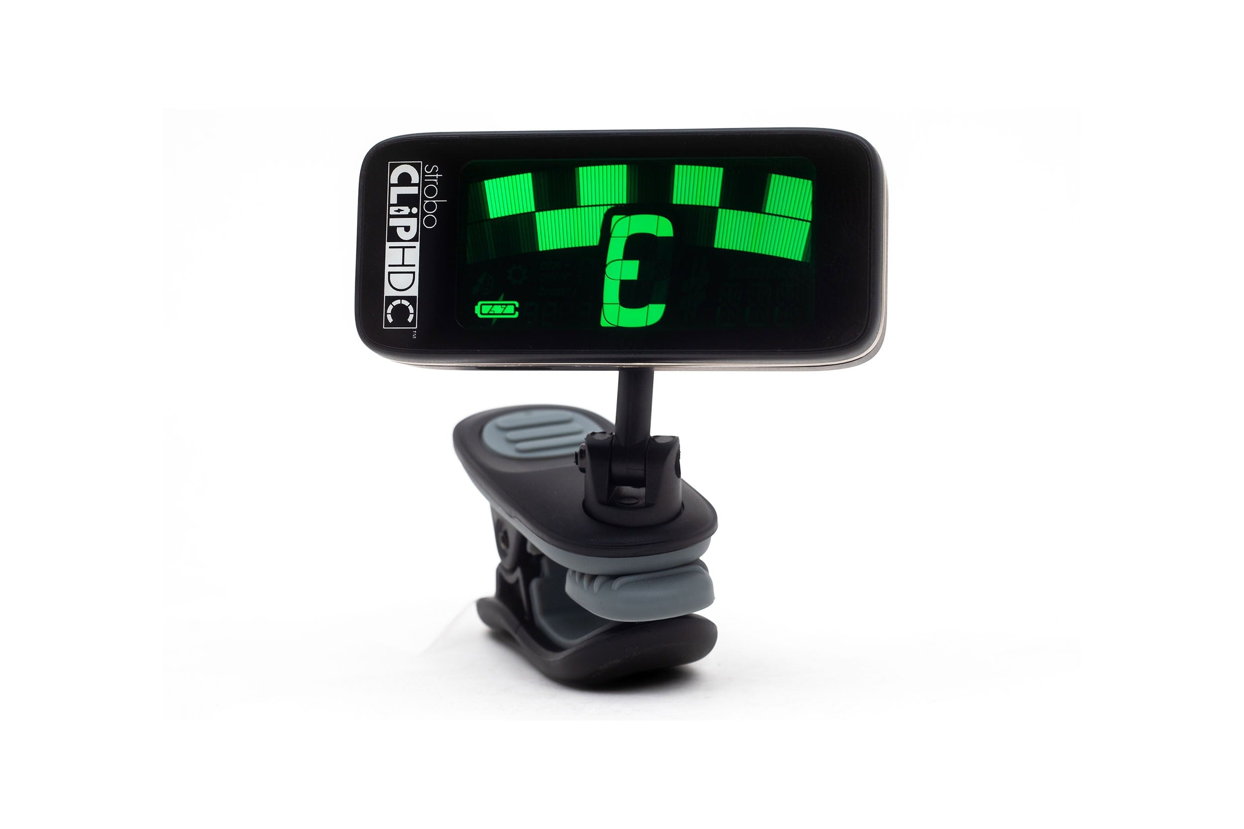 Black clip-on tuner with green screen displaying tuning bars and note indicator.