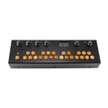Black music device with wooden buttons, six rotary knobs, a small screen, and a speaker grille on top.