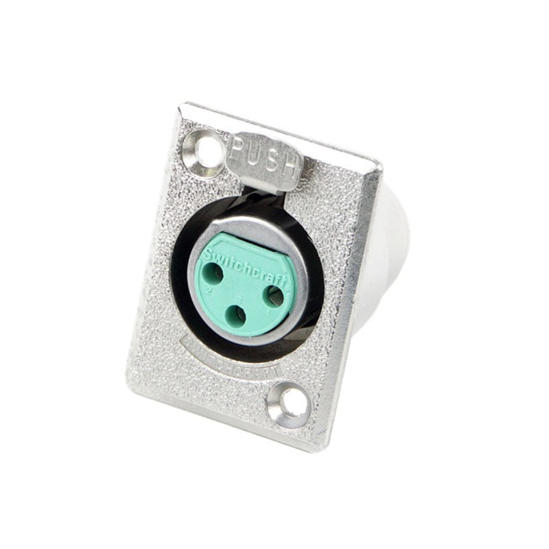 Silver metal panel mount with green 3-pin circular socket labeled Switchcraft and a push-release tab.