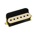 Two-coil black and cream-colored guitar pickup with gold mounting frame on white background.