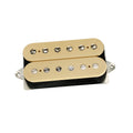Cream-colored humbucker guitar pickup with six adjustable pole screws and mounting plate on white background.