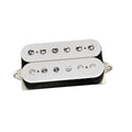 White electric guitar humbucker pickup with visible adjustable screw pole pieces on one bobbin and metal pole pieces on the other.