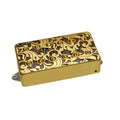 Gold and black decorative guitar pickup with twelve pole pieces in two rows.