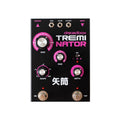 Black Dreadbox Treminator pedal with pink and silver knobs, 3.5mm jacks, toggle switch, and footswitches.