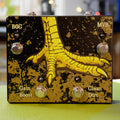 Black and gold pedal with a large yellow bird claw graphic and four footswitches labeled BOG, MVB, Gain Boost, and Clean Dirt.