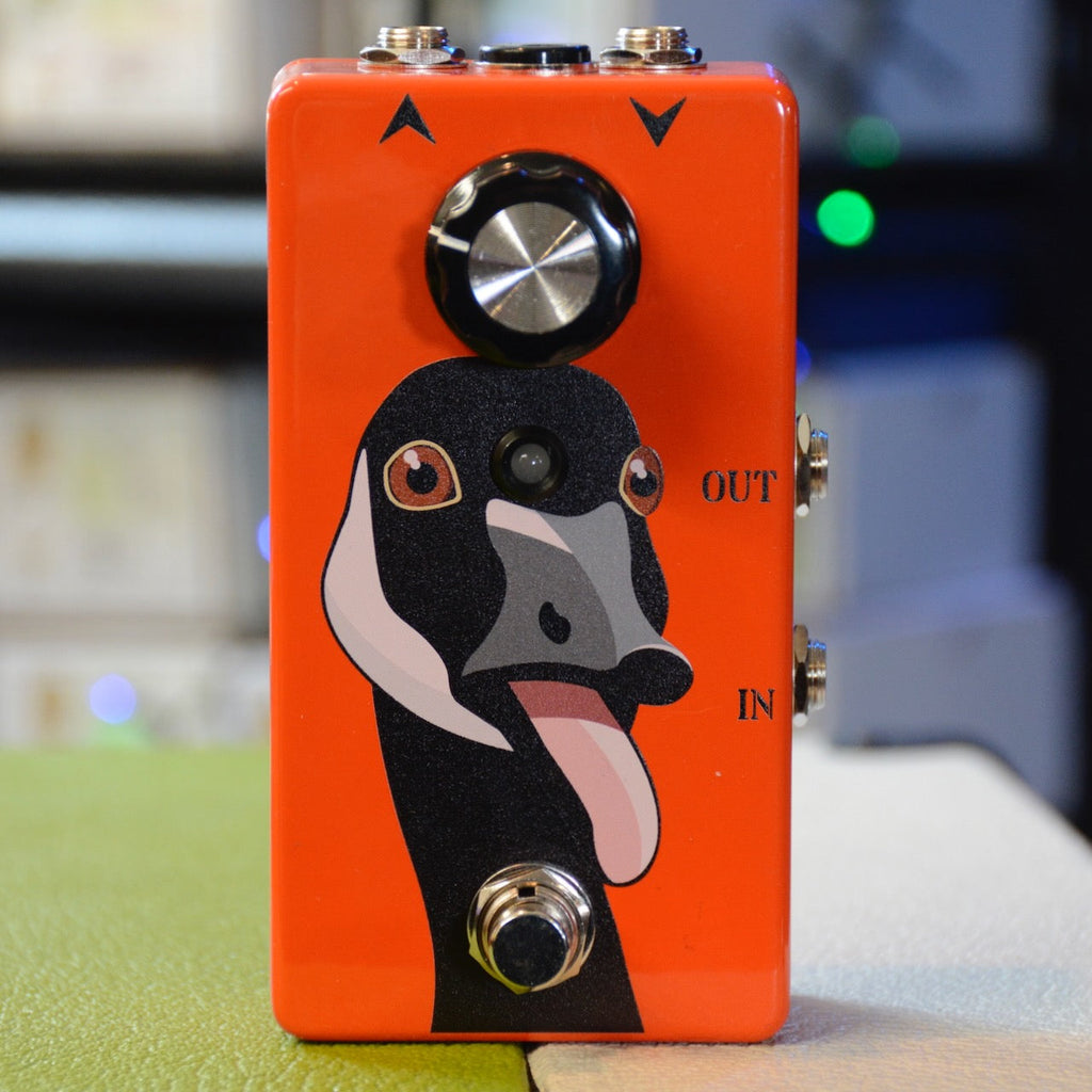 Orange guitar effects pedal with a goose graphic, one knob, one footswitch, and two side input/output jacks.