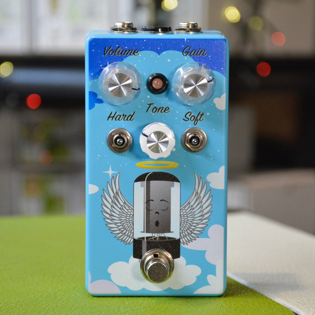 Blue guitar effects pedal with volume, gain, tone knobs and toggle switches labeled Hard and Soft