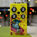 Yellow guitar effects pedal with four control knobs labeled Drive, Bright, Volume, Mode and a footswitch.