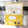 Gold guitar effects pedal with white knobs, toggle switch, footswitch, and whale graphic labeled Moby Depth.