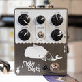 Black guitar effects pedal with five knobs, one toggle switch, one footswitch, and cartoon whale graphic labeled Moby Depth.