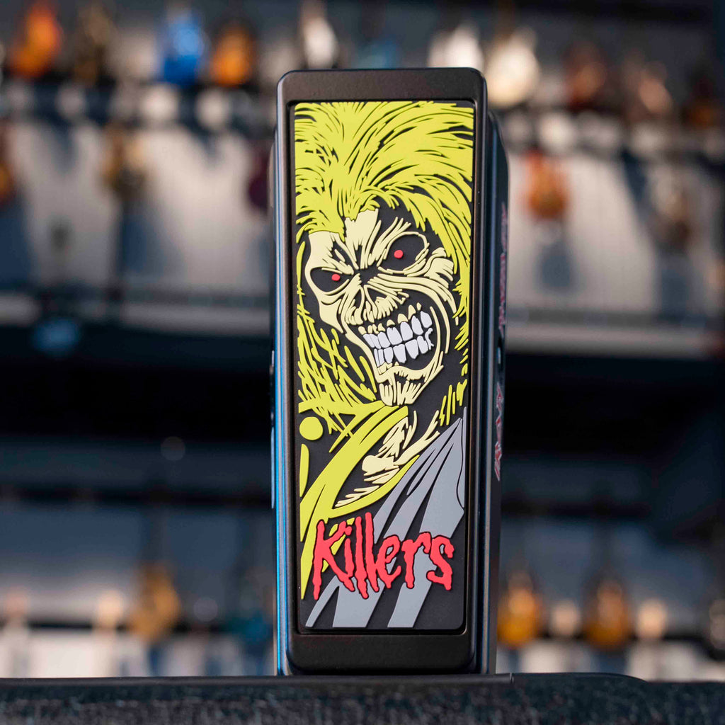 Front view of a guitar wah pedal with graphic art of a skull-faced character and red text reading Killers.