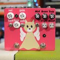 Pink guitar effects pedal with knobs, toggle switches, footswitches, and a cartoon angel dog graphic.