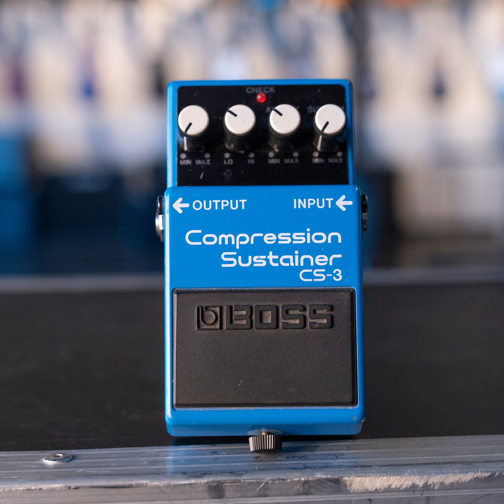 Blue guitar effects pedal with four knobs labeled Compression Sustainer CS-3 and BOSS logo.