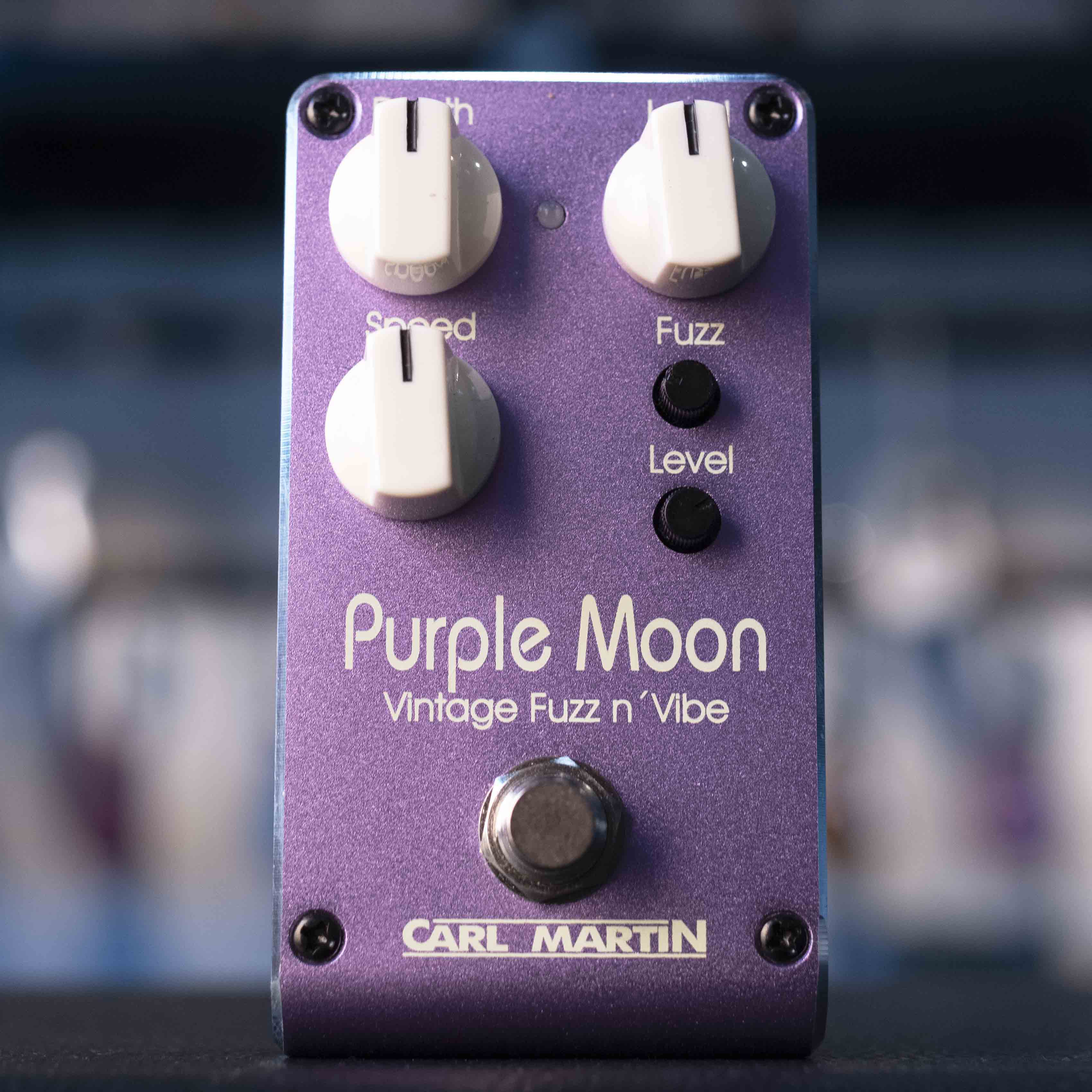 Purple guitar effects pedal with knobs labeled Speed, Fuzz, Level, and a footswitch, branded Carl Martin.