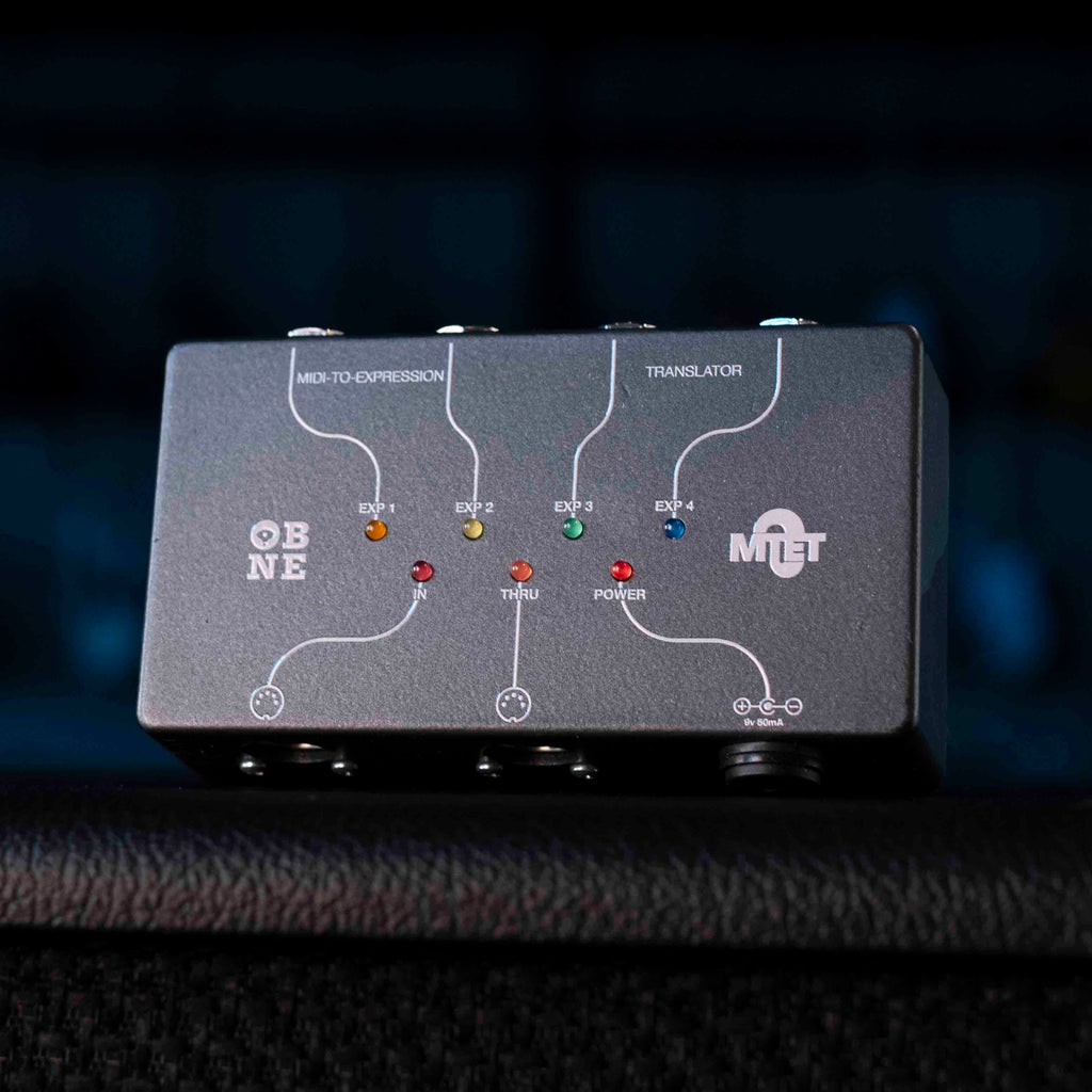 Black MIDI to expression translator device with LED indicators and MIDI ports labeled for input, thru, and expression outputs.