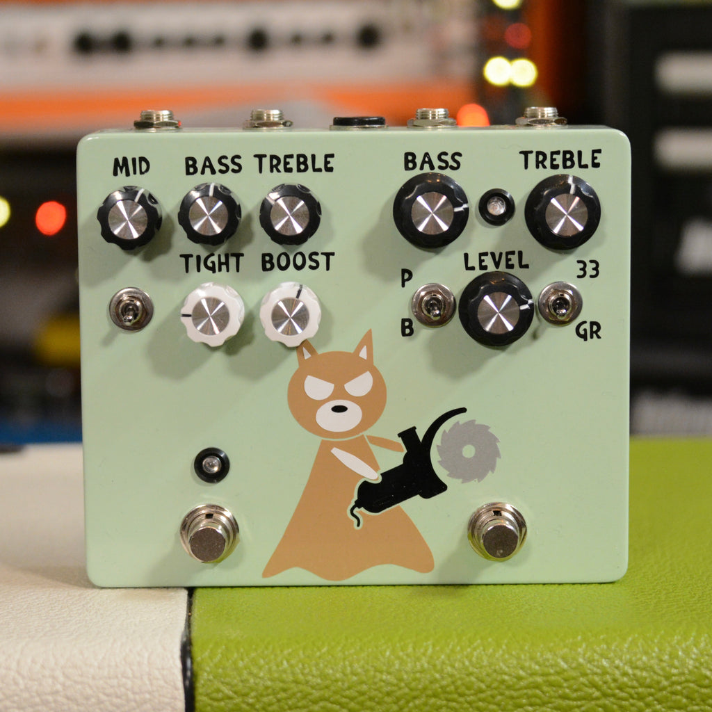 Light green guitar effects pedal with multiple knobs, switches, two footswitches, and cartoon dog graphic holding a power tool.