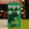 Green pedal with broccoli graphic, five control knobs, toggle switch, and footswitch on front panel