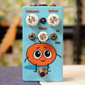 Light blue guitar effects pedal with Volume, Drive, Tone controls and a cartoon pumpkin illustration on front.