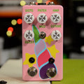 Pink guitar effects pedal with six white knobs, one toggle switch, two footswitches, and colorful unicorn design.