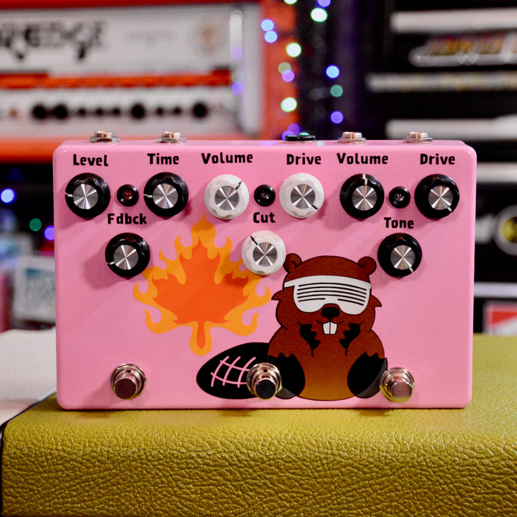 Pink guitar effects pedal with multiple knobs and three footswitches, decorated with a beaver and flame graphic.
