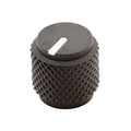 Small black knurled cylindrical knob with a white line indicator on top.