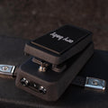 Black guitar pedal labeled Cry Baby with two input/output jacks and a footswitch.