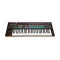 Black Yamaha DX7 programmable algorithm synthesizer keyboard with modulation and pitch wheels and multiple buttons.