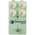 Light green guitar effects pedal with four cream knobs and a footswitch labeled Diamond Vibrato.