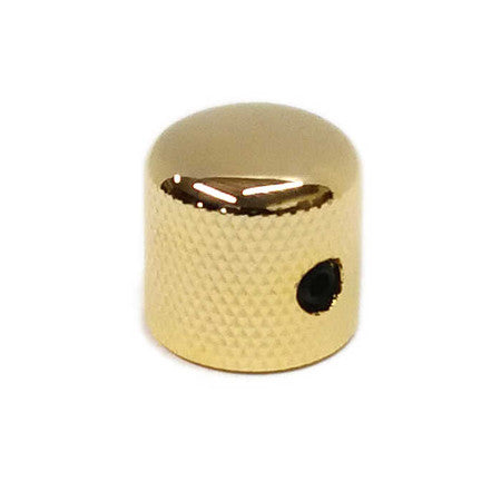 Small gold-toned metal dome knob with textured sides and a black set screw visible.