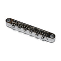 Chrome metal guitar bridge with six adjustable saddles and screw adjusters on a white background.