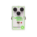 White guitar effects pedal with black knobs labeled volume, octave, and balance, plus footswitch and input/output jacks.