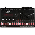 Black digital drum synthesizer with multiple faders, buttons, rotary knobs, and connectors on top panel.