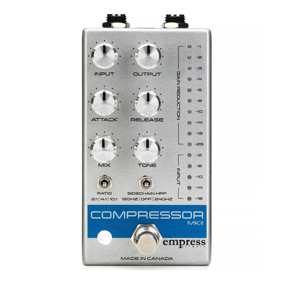 Silver pedal with six control knobs, two toggle switches, LED meters, and a footswitch labeled Compressor MKII by empress.