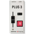 White rectangular device labeled PLUS 3 with a black slider, a small black switch, and a red push button with popcorn icon.