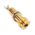 Gold-colored metal audio jack connector with a threaded barrel and a locking nut.